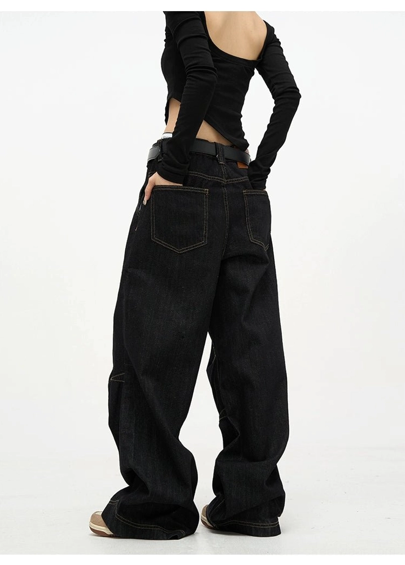 Back view of high waist black baggy denim jeans featuring classic rear pockets and an oversized wide leg silhouette
