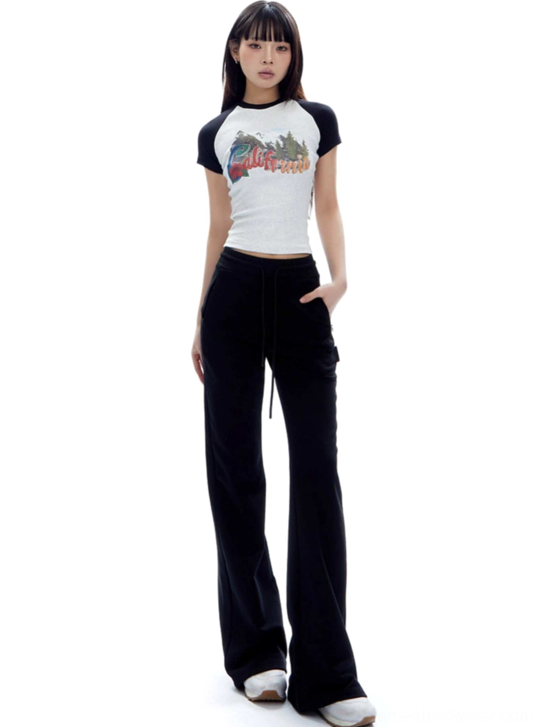 High-waist drawstring streetwear sweatpants with flared legs and a streamlined upper-leg fit shown in a product image