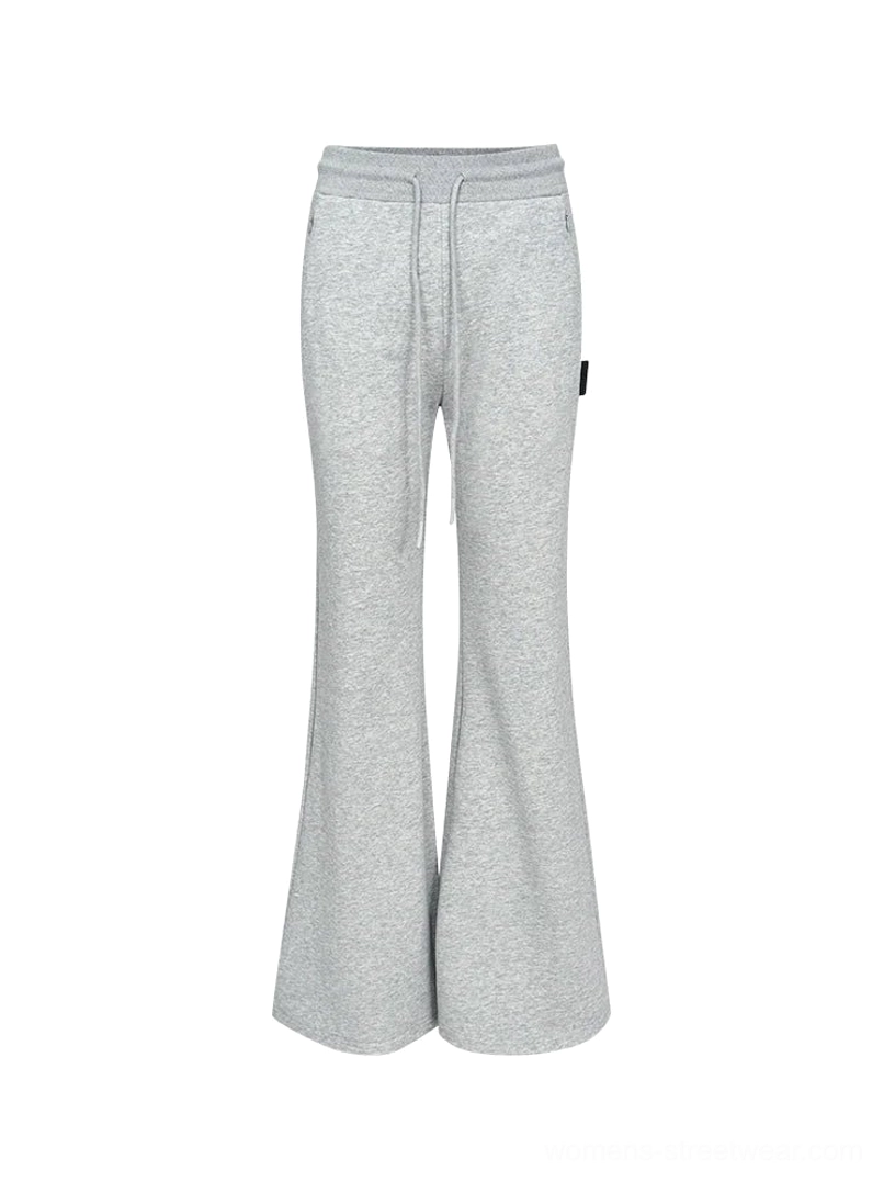 High-waist flared sweatpants product image highlighting the modern streetwear shape, adjustable waist, and long hem