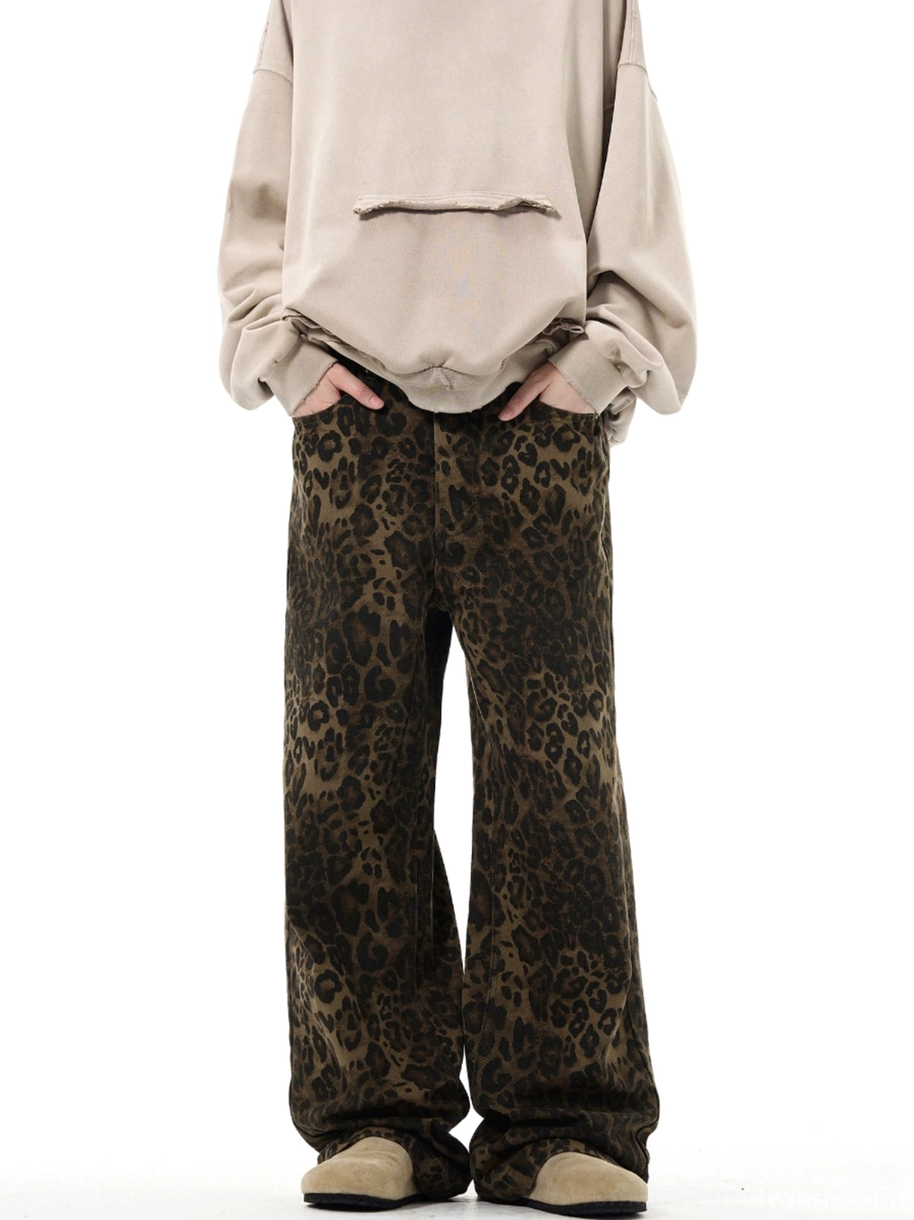 High-waist leopard print streetwear trousers front view showing bold brown black animal print and wide legs