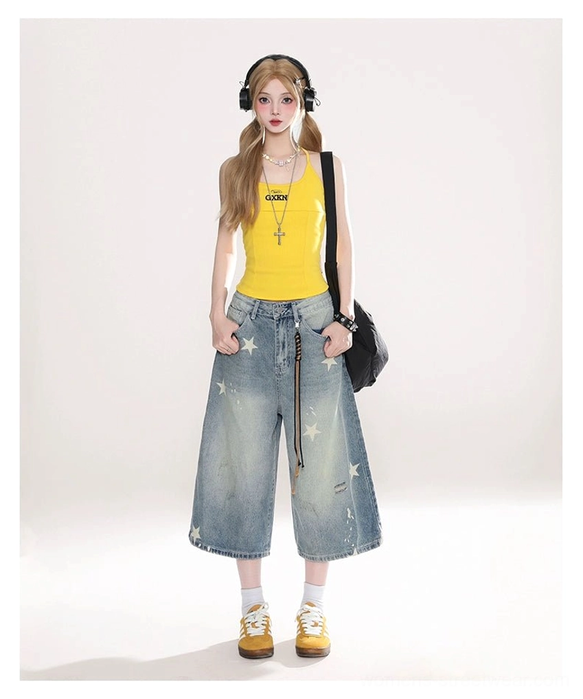 Female model styling high waist star print cropped wide leg denim jeans in a Seoul streetwear look