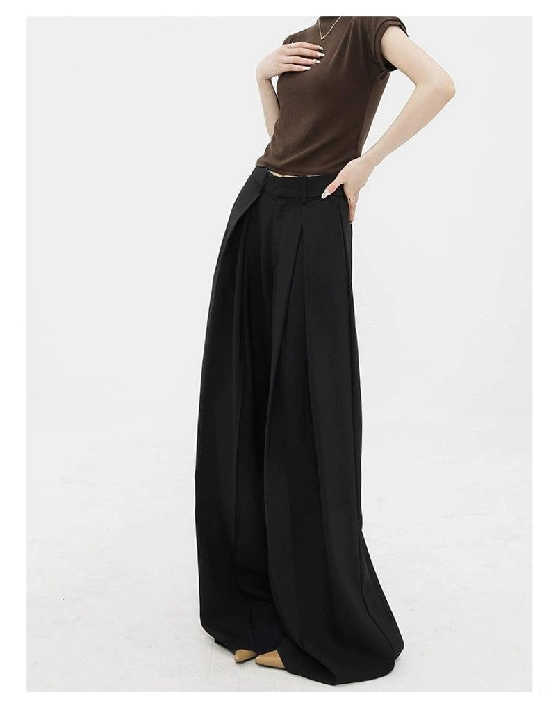 Black high-waist palazzo streetwear pants side view showing fluid floor-length wide-leg silhouette