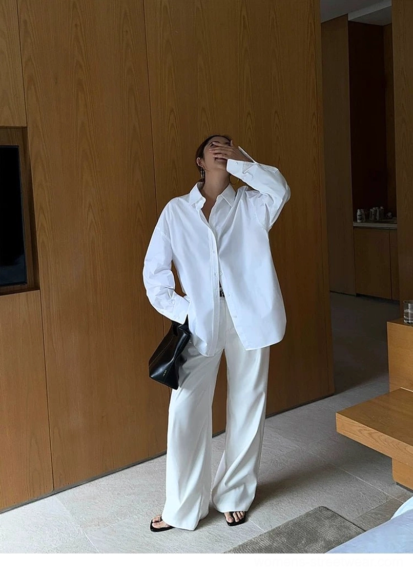 High-waist wide-leg streetwear suit trousers with a fluid tailored drape and minimalist fashion styling
