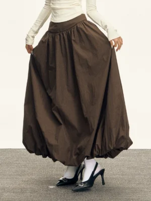 High waisted bubble maxi skirt shown in brown studio sample with gathered elastic waist and puffed floor-length hem