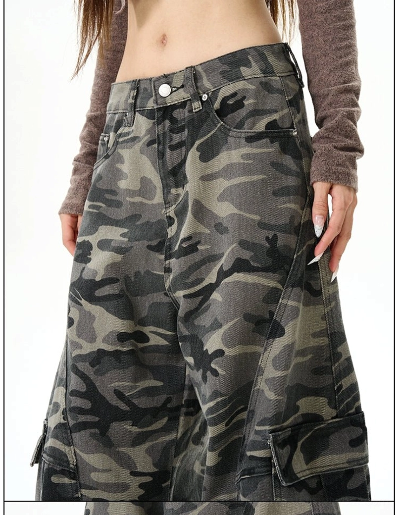 Close-up of the high-waisted camouflage cargo pants showing the button fly, waistband, front trouser pockets, and cotton-blend fabric