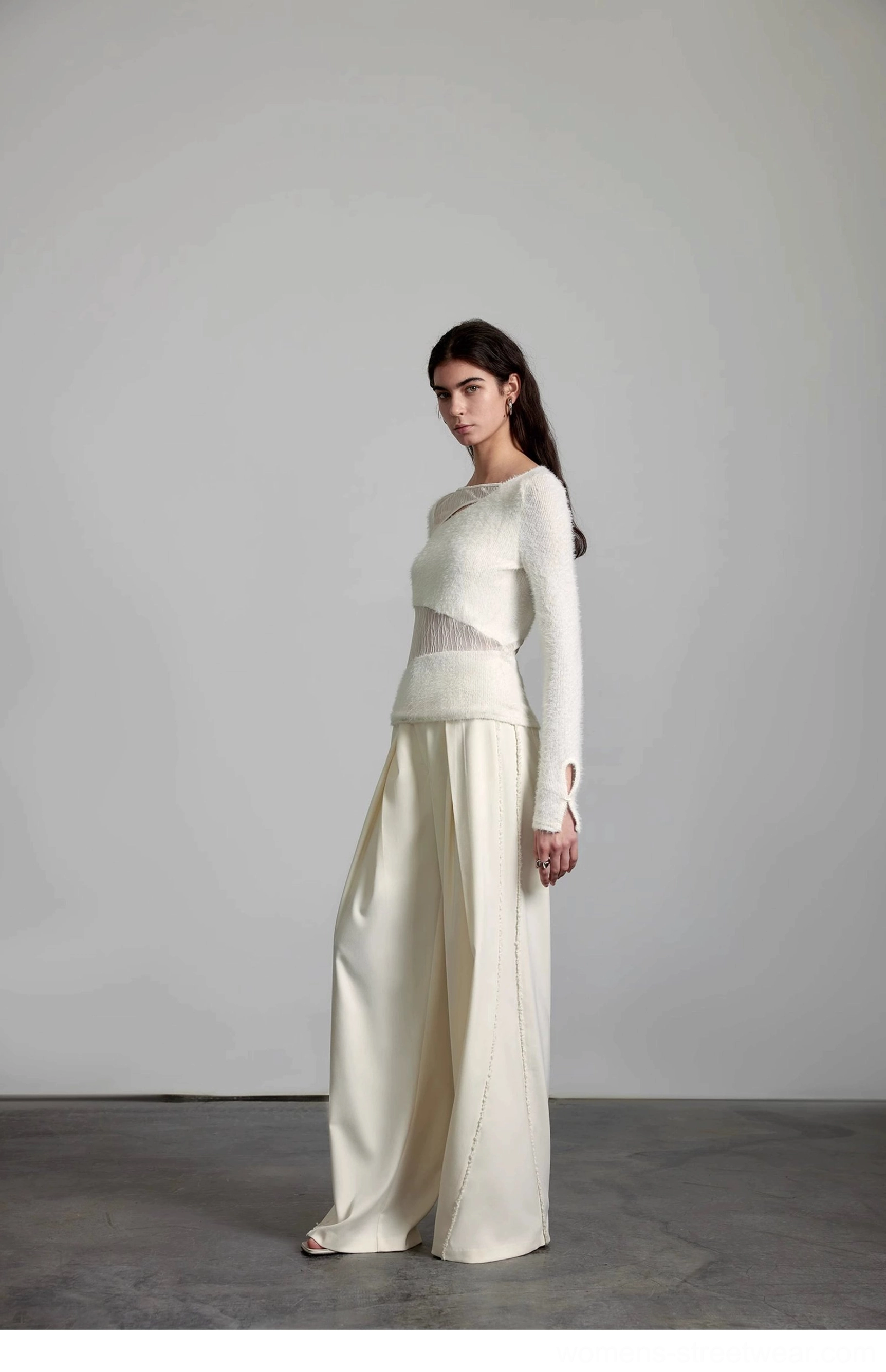 High-waisted cream streetwear pants with relaxed wide-leg tailoring for versatile everyday outfits