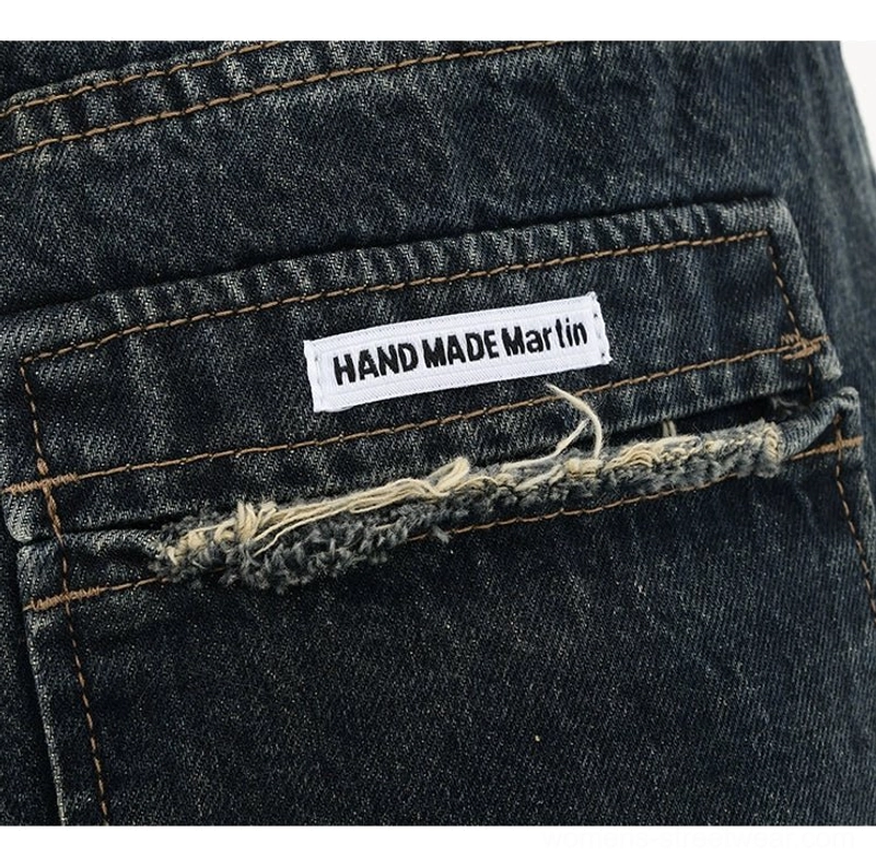 High-waisted dark blue wide-leg denim pants with vintage washed streetwear aesthetic