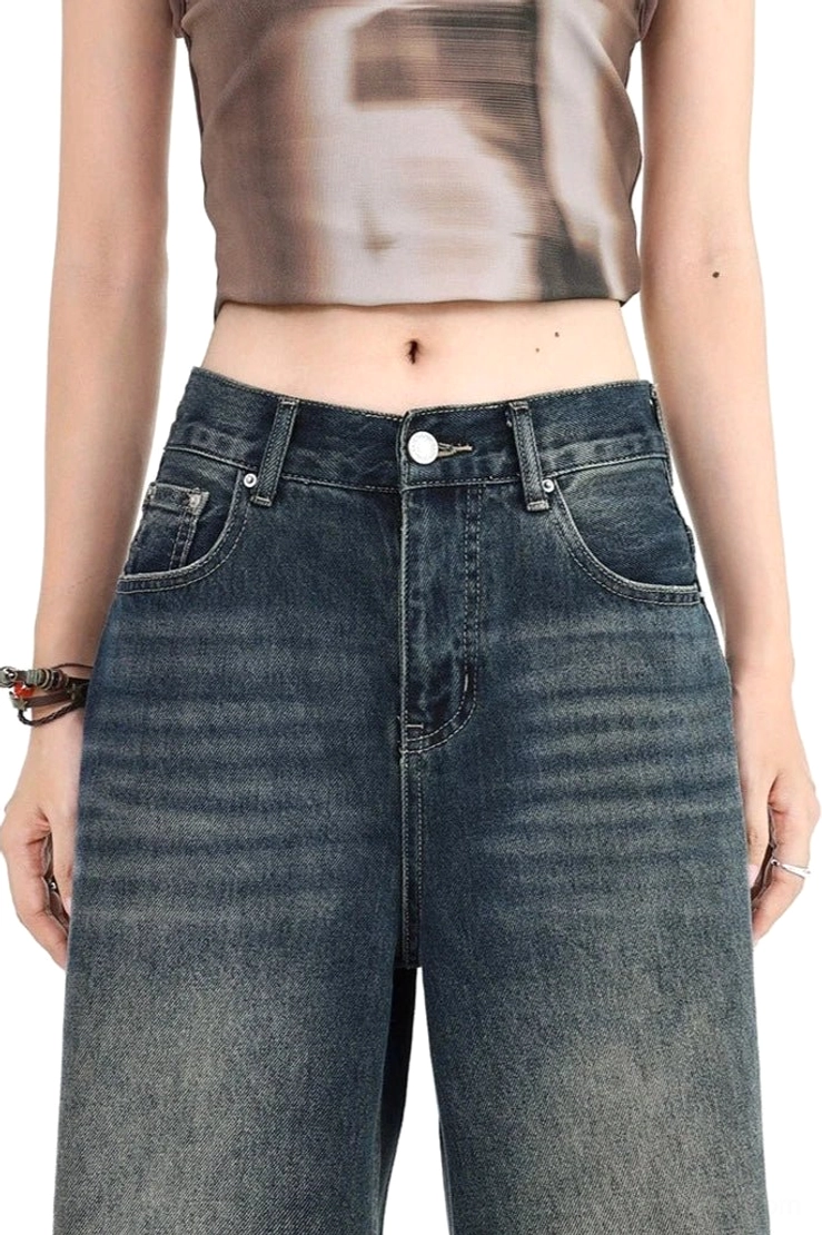 High-waisted distressed wide leg ripped jeans in vintage blue dark wash denim with relaxed proportions, frayed openings, raw hem character, and modern Acubi-inspired styling