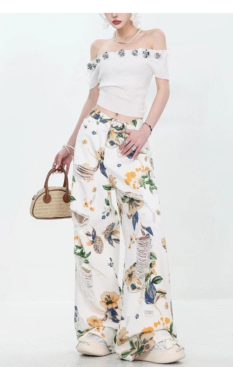 High-waisted floral print wide-leg denim pants with distressed streetwear styling
