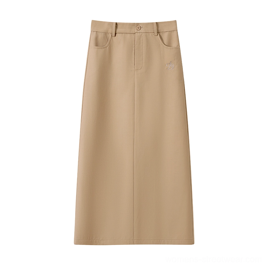 Flat lay front product view of a high waisted khaki maxi skirt with side pockets and zipper closure on a white background