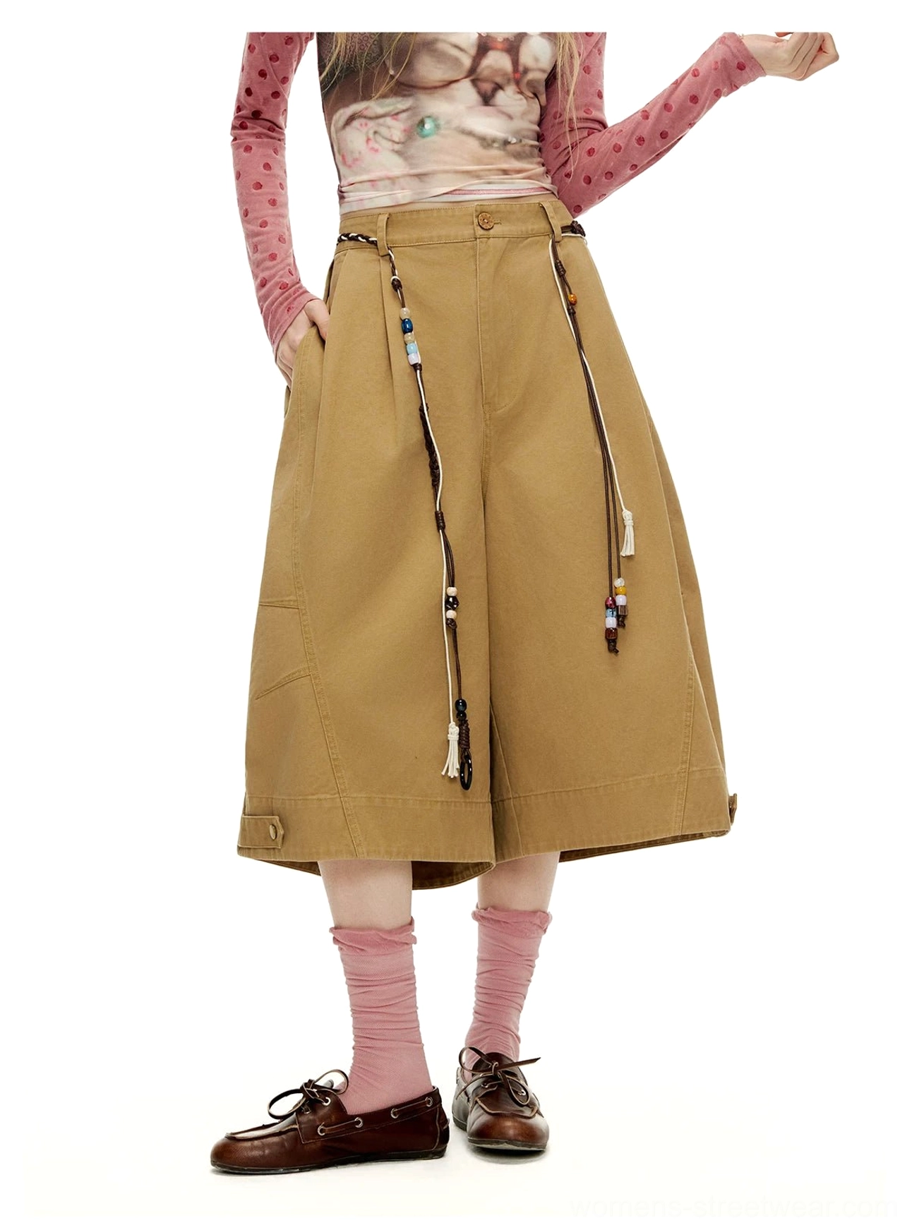 Cookie Brown sailor culottes close-up showing high-waisted front pleats, beaded belt styling, and buttoned hem detail
