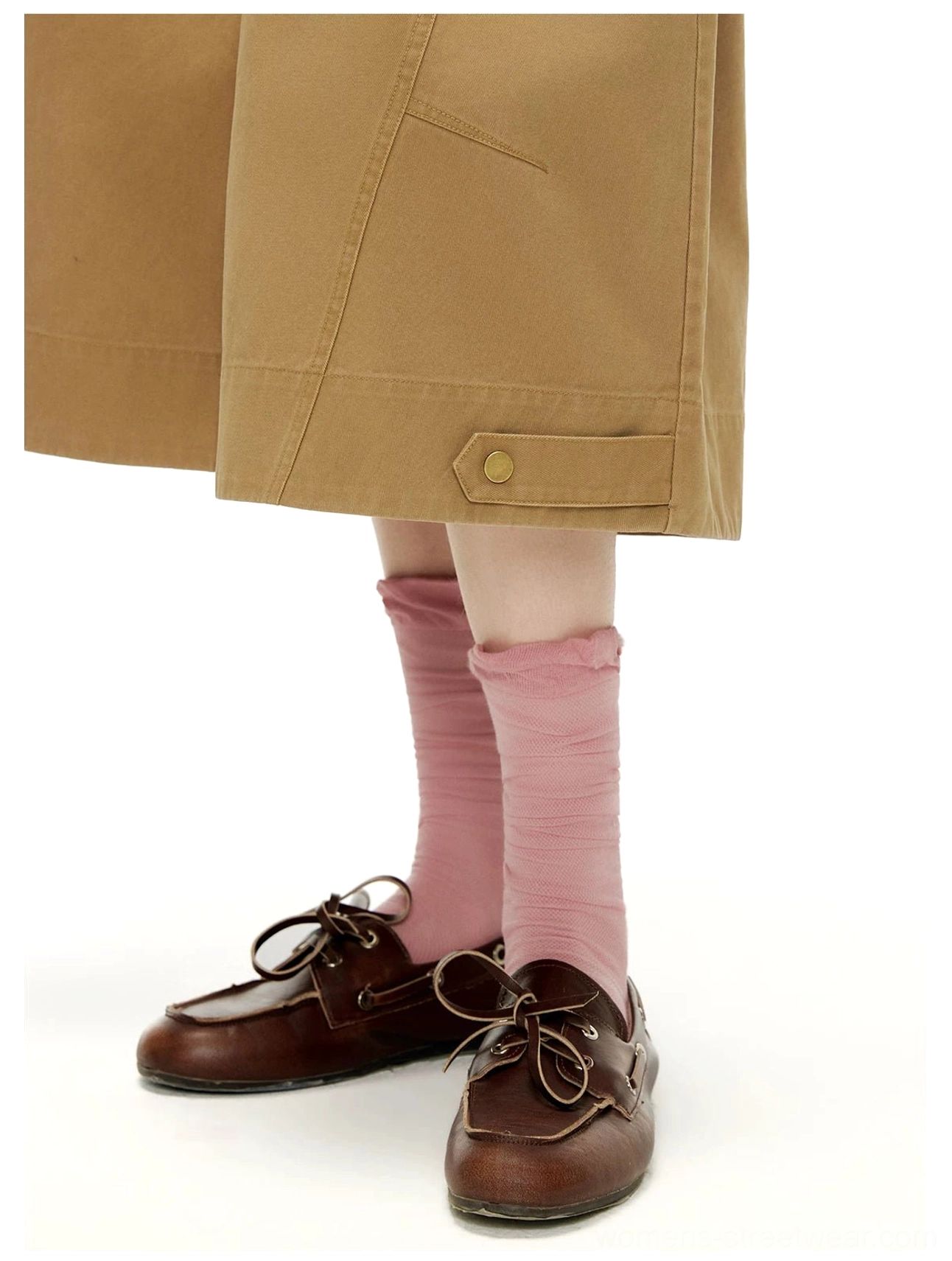 Close-up of cropped wide sailor culottes hem styled with pink socks and brown leather boat shoes