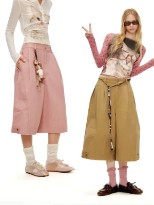 Dried Roses pink high-waisted wide sailor culottes styled with cat print long sleeve tops in a white studio