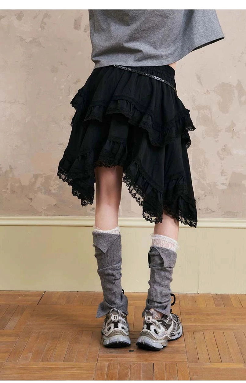 Fashion-forward hooded jacket and tiered lace skirt outfit combining athletic windbreaker styling with romantic ruffled streetwear layers