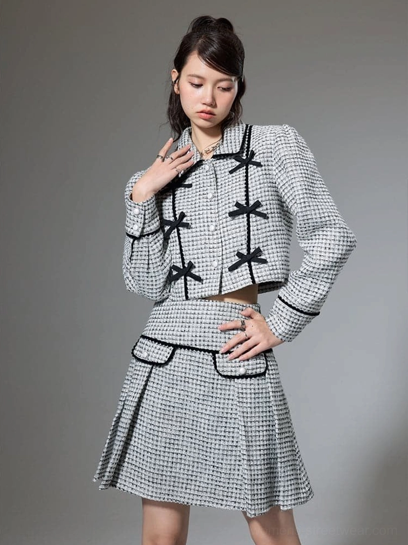 Textured houndstooth cropped jacket and pleated mini skirt with black bow trim in Korean streetwear style