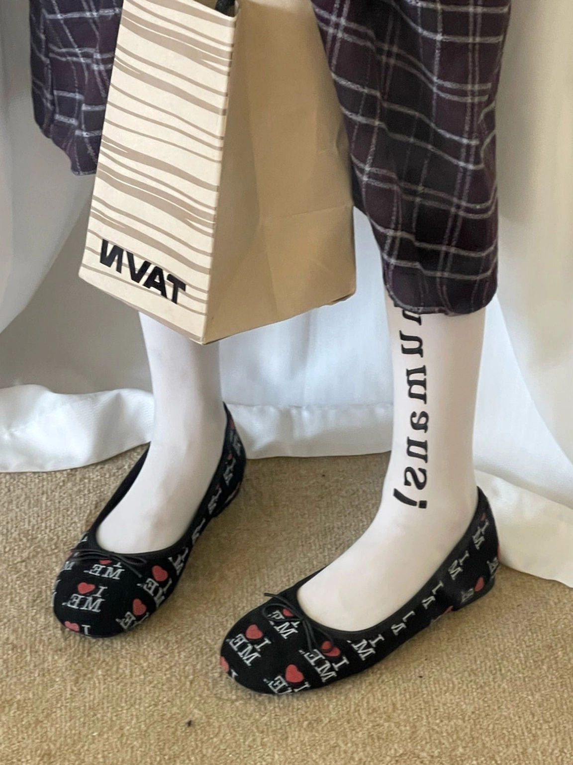 Black I Love Me print ballet flats with flexible flat sole styled with letter print socks and plaid skirt