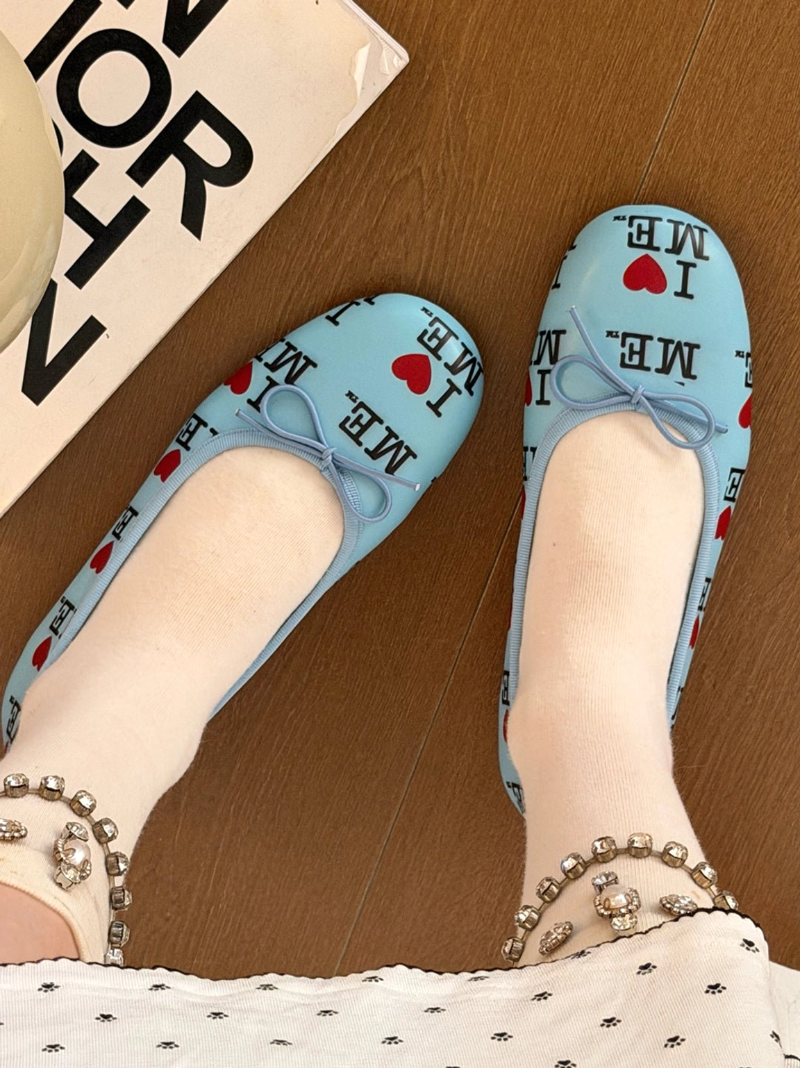 I Love Me print round-toe ballet flats with petite bow detail and low-profile rubber sole