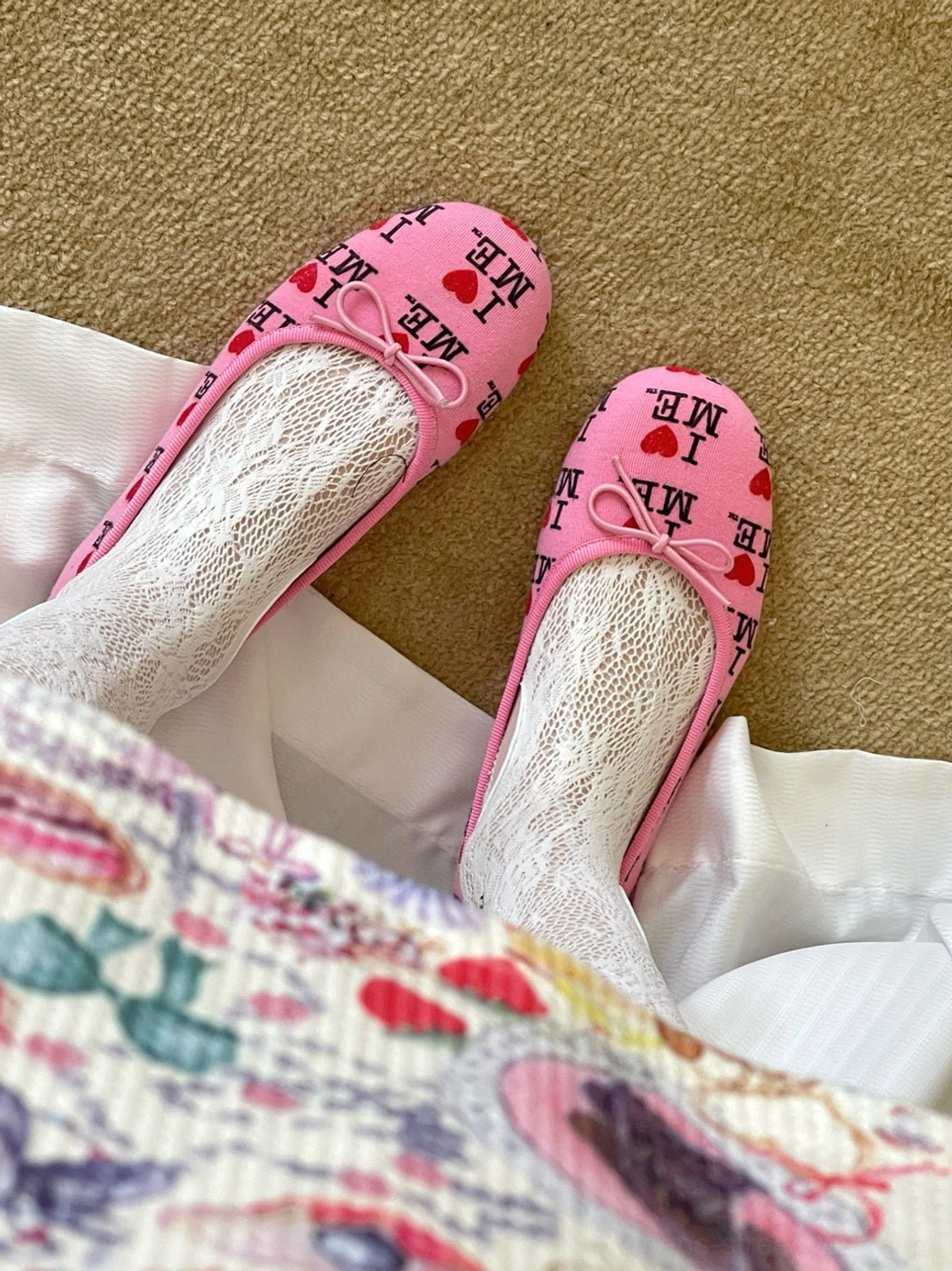 Pink I Love Me print round-toe ballet flats worn with lace socks and floral skirt for a balletcore outfit