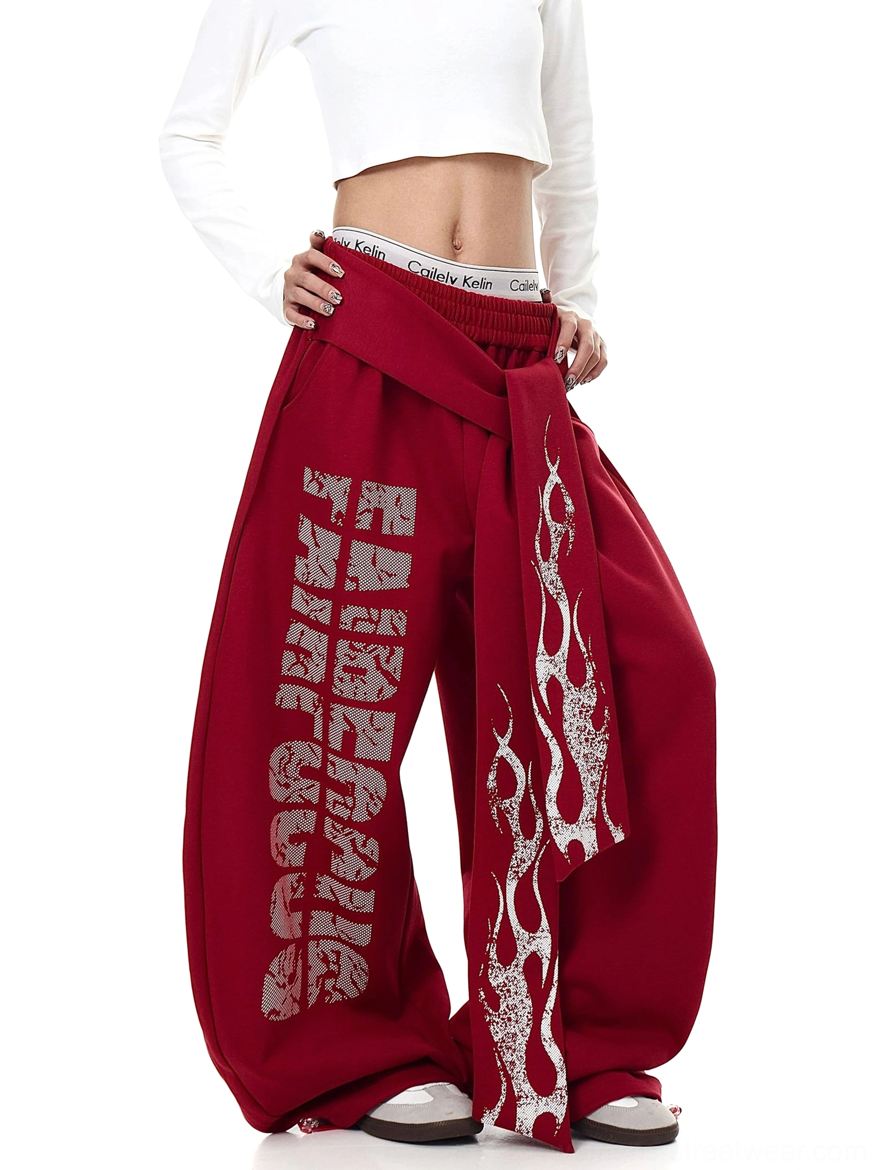 Burgundy inferno wrap sweatpants styled with cropped top and skate shoes showing oversized streetwear fit