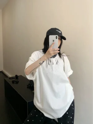 White ink splash halo oversized graphic tee back view showing relaxed hip-length streetwear silhouette