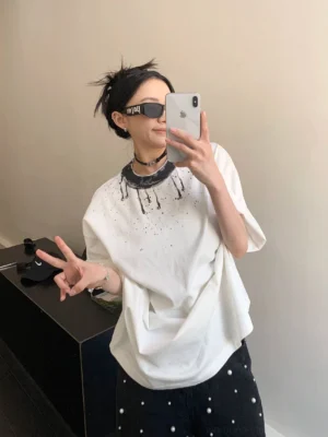 White ink splash halo oversized streetwear tee front view with dripping collar and abstract chest splatter graphic