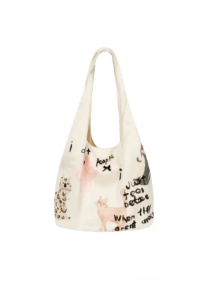 Off-white cat doodle hobo tote bag shown flat with handwritten slogan graphics, cartoon kitten illustrations, leopard print accents, and a wide shoulder strap