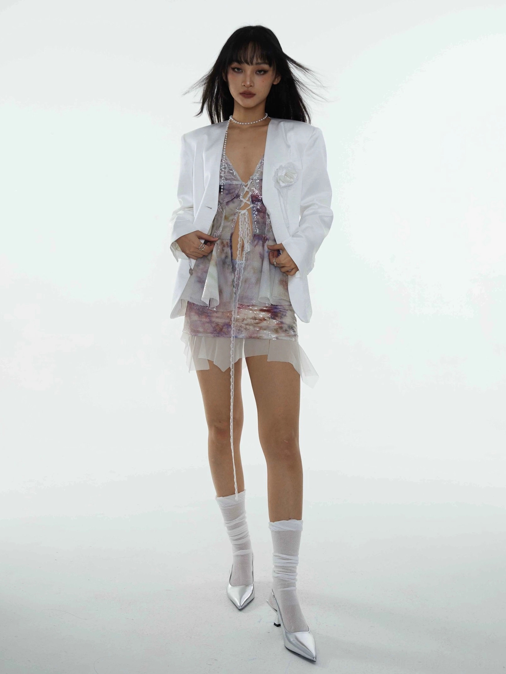 Iridescent watercolor sequin mini skirt styled with a crisp white blazer for a polished Korean fashion and partywear look