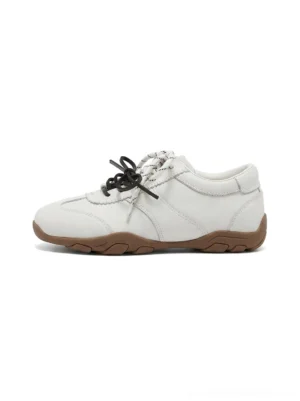 Ivory double-lace gum sole retro streetwear trainers side view with layered ivory upper and brown rubber outsole