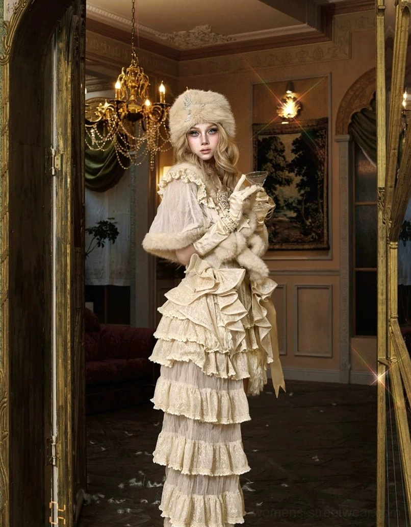 Side view of ivory faux fur lace capelet creating a soft romantic layer over a vintage inspired formal gown