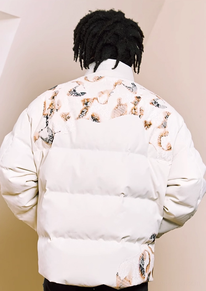 Back view of oversized ivory flame lace cropped puffer jacket showing all-over graphic quilting