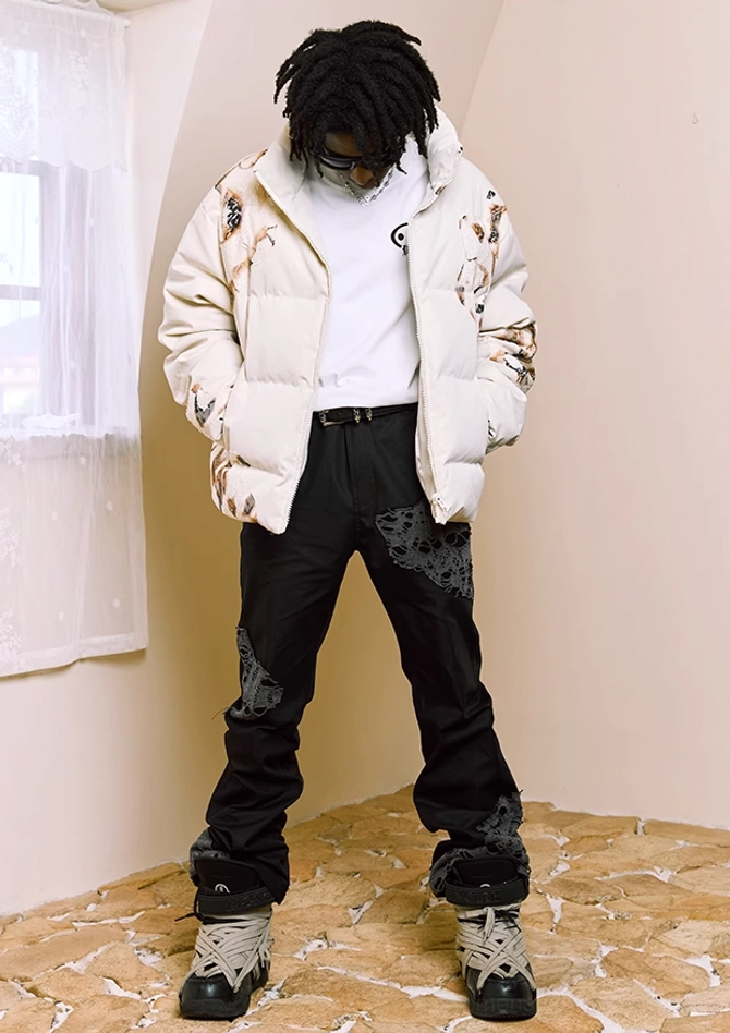 Ivory flame lace cropped puffer jacket close-up showing statement print and zip-up streetwear styling