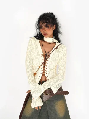 Ivory floral lace-up textured cardigan styled with a vintage denim skirt and leather belt in a front studio view