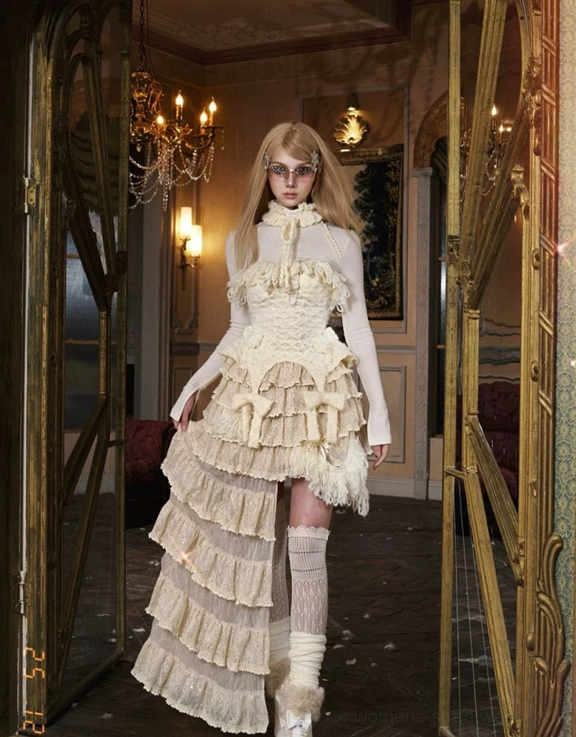 Ivory fringe knit corset top product fashion view highlighting the sculpted corset-inspired silhouette and soft textured knit finish