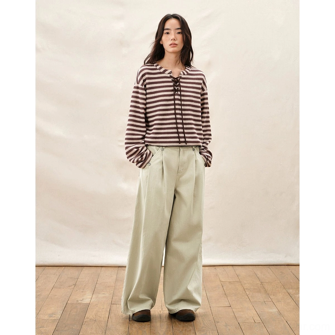 Ivory high waisted pleated wide leg pants styled with a striped lace up top for casual Korean fashion