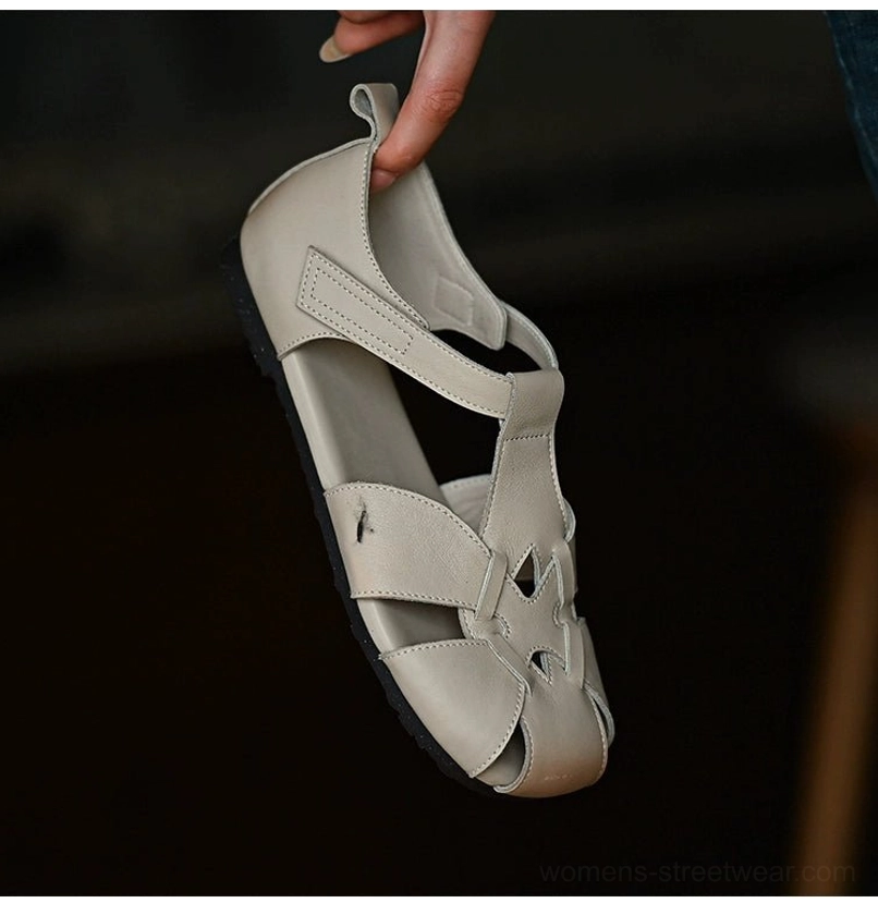 Ivory hollow-out woven strap sandals with square closed toe and ankle buckle shown from an inner overhead angle