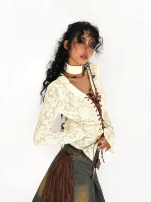 Ivory lace-up lace cardigan shown from the side and back with fitted shape, brown straps, and flared sleeves