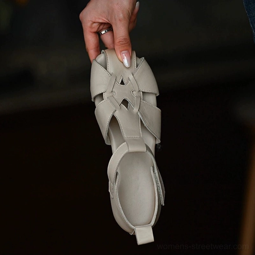 Ivory leather cutout fisherman sandals with square closed toe and woven hollow-out straps shown from an overhead view