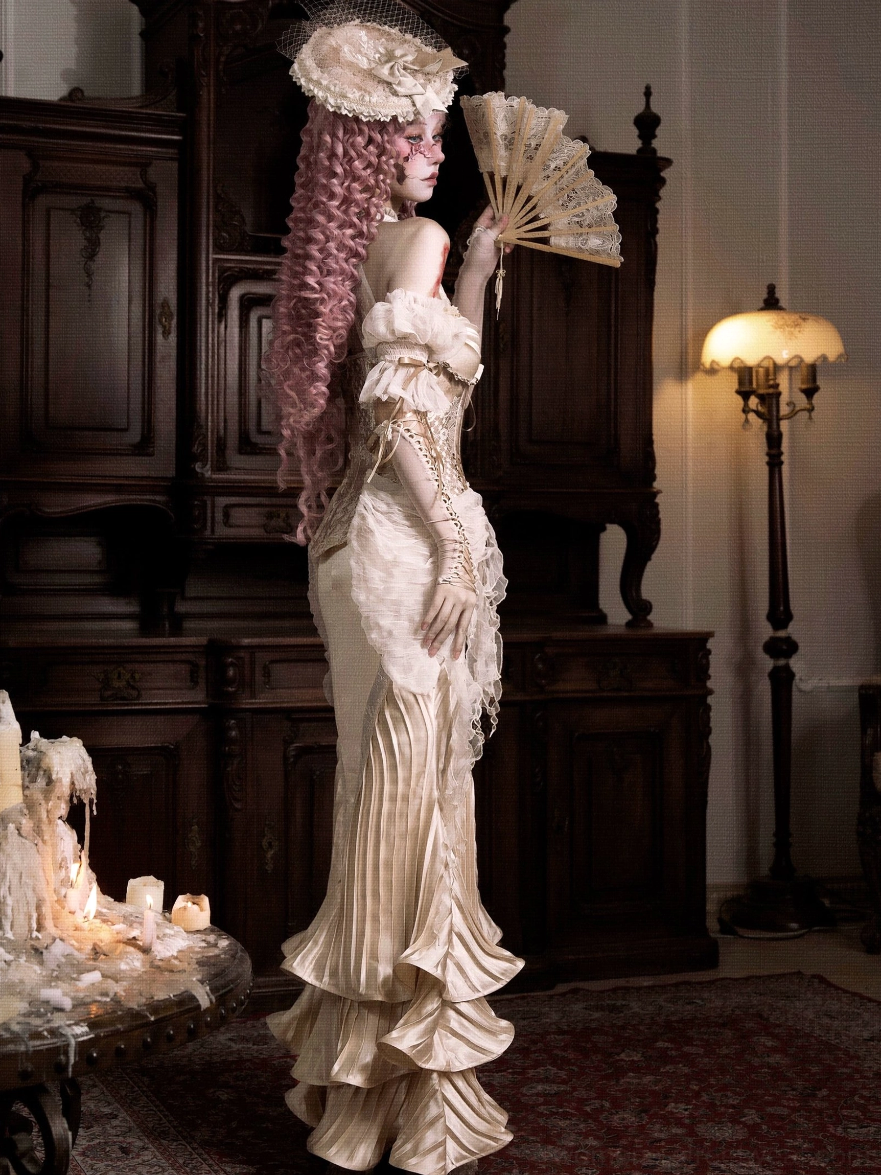 Side back view of ivory ruffled mermaid skirt styled in a Victorian-inspired formal outfit