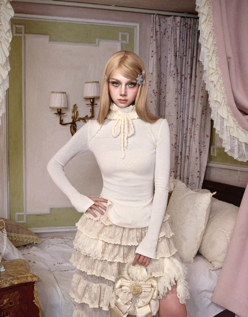 Full body view of ivory high-neck bow tie peplum knit top with a tiered ruffle maxi skirt for romantic Seoul fashion styling