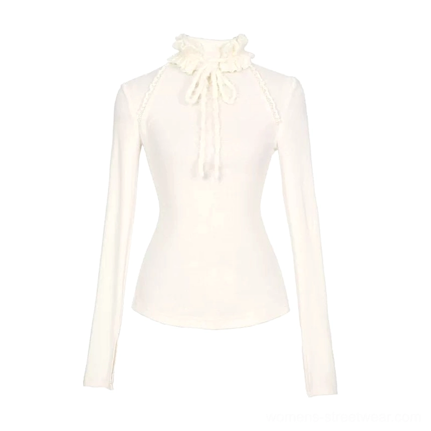 Ivory tie-neck peplum knit base layer top product view with fitted stretch silhouette
