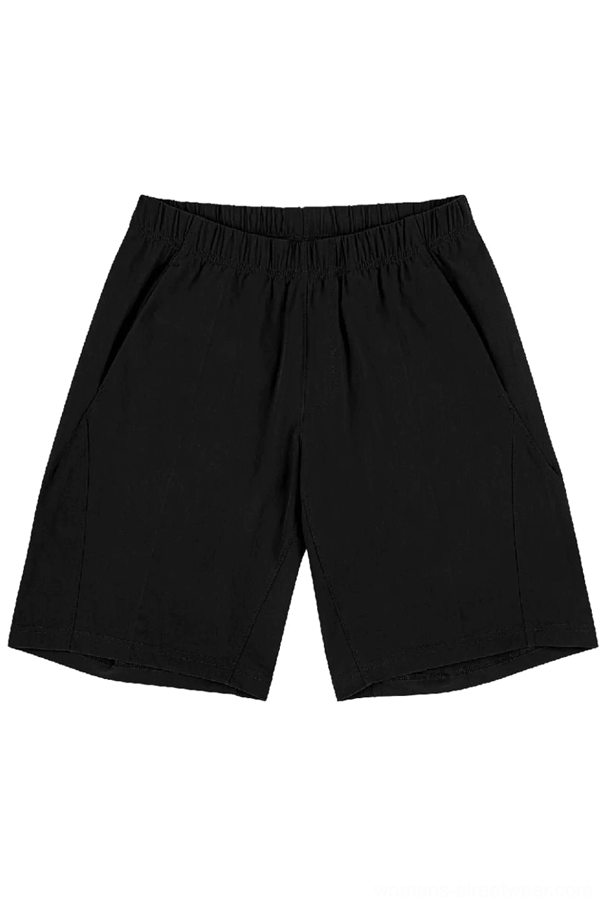 Front view of jet black quick-dry tech shorts with elastic waistband, hidden angled pockets, and streamlined oversized fit