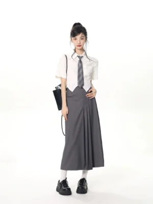 complete JK school uniform set styled with black handbag white socks and black loafers full body view
