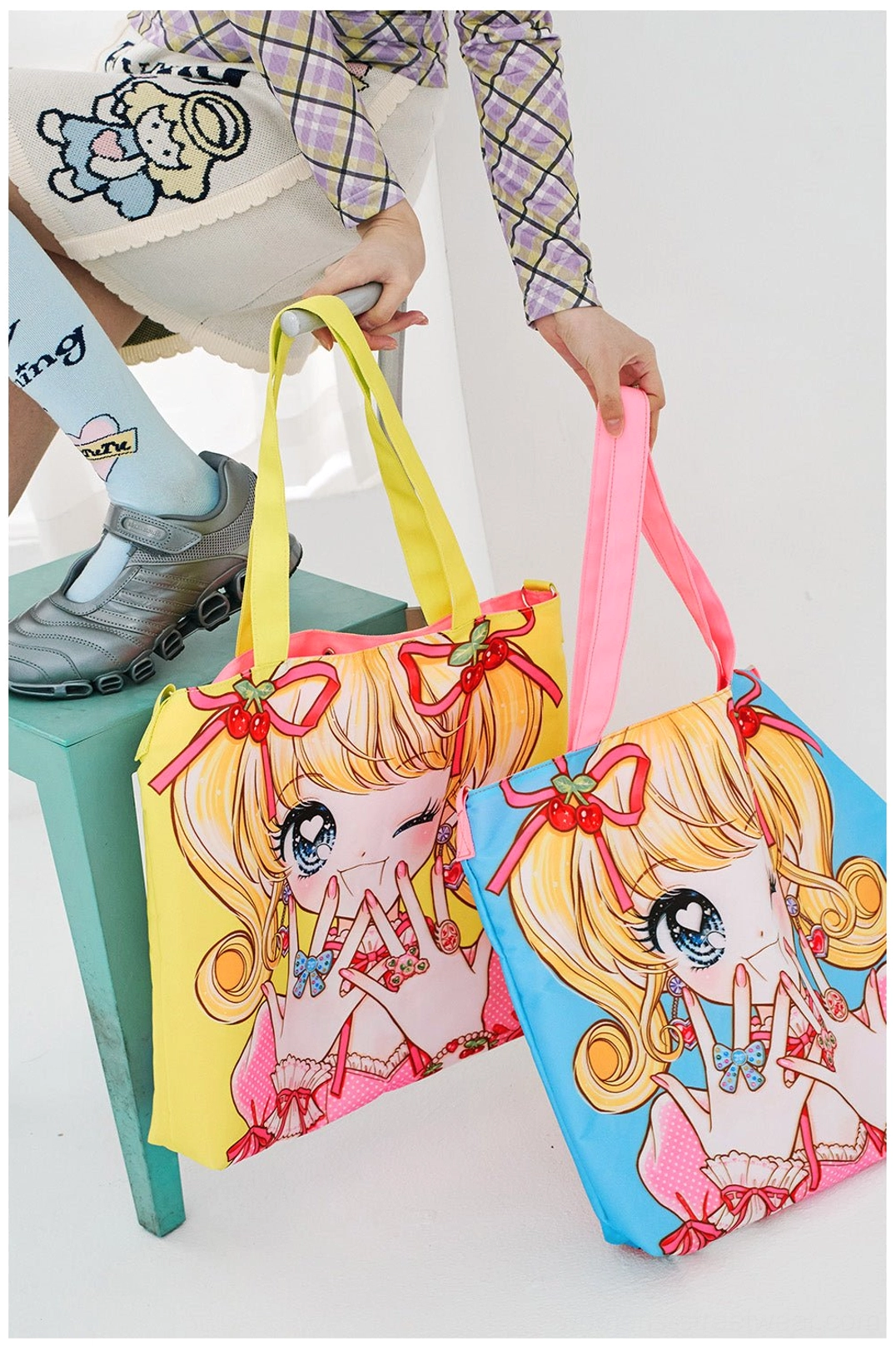 Blue and yellow kawaii anime girl convertible tote bags with colorful shoulder straps shown in a casual streetwear setting