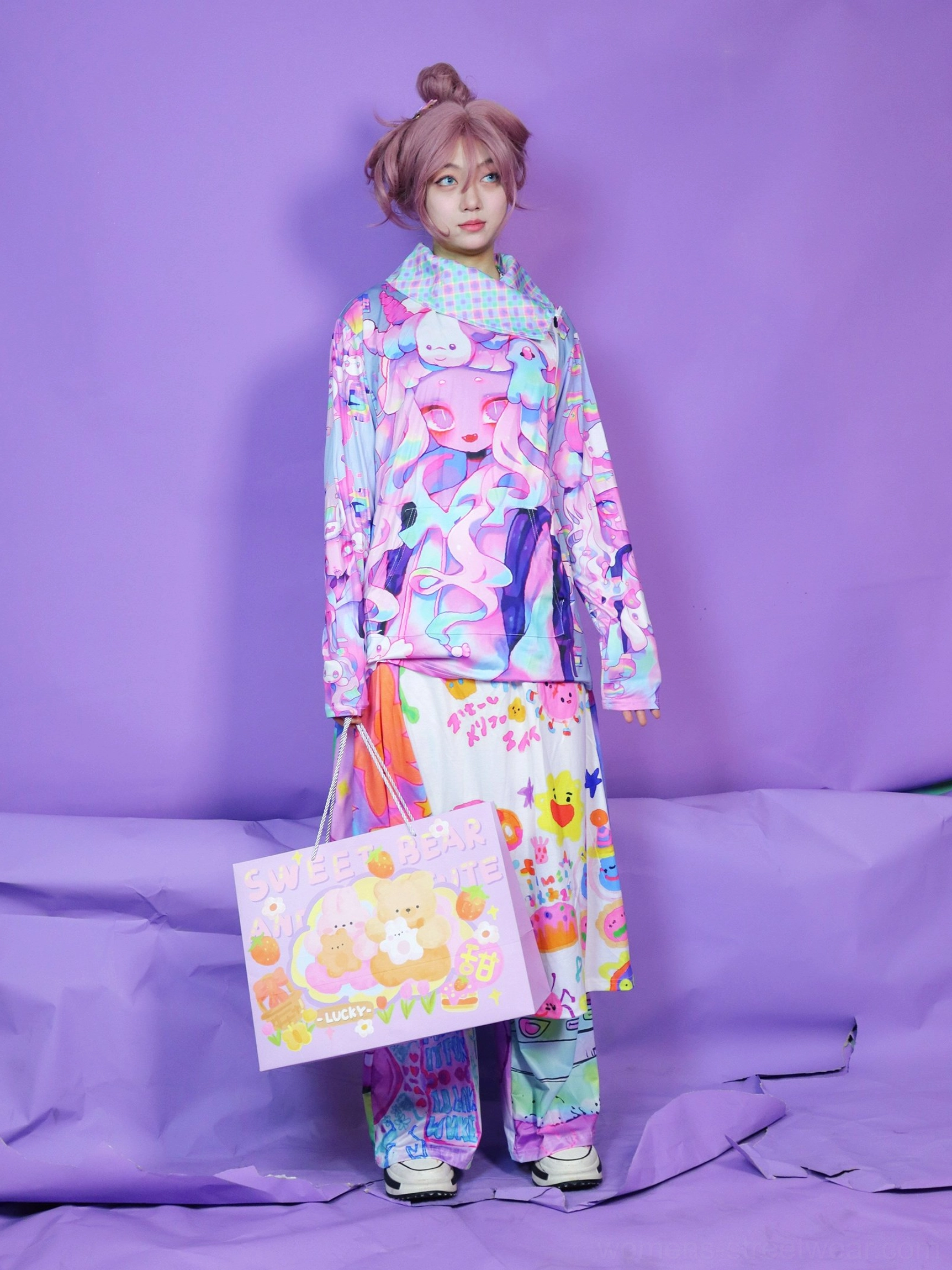 Side view of a kawaii psychedelic print sweatshirt worn with matching printed pants in colorful anime streetwear style