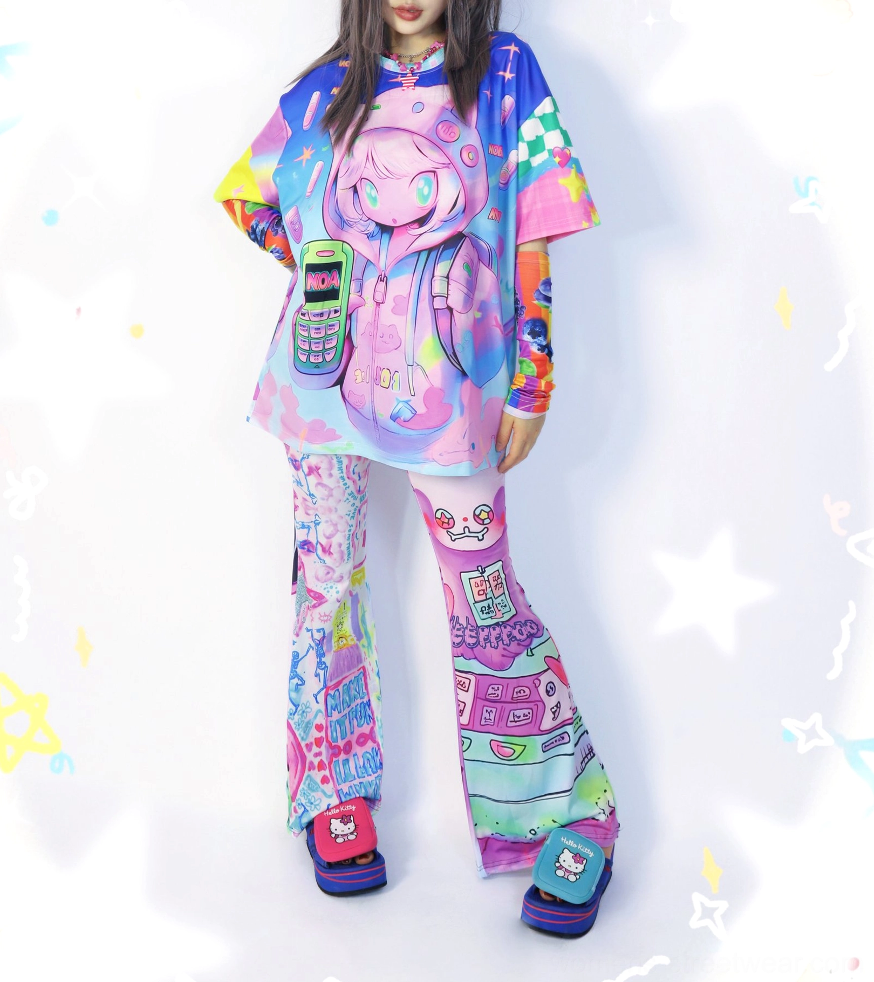 Full body Y2K kawaii streetwear outfit featuring an oversized retro phone graphic T-shirt styled with matching colorful printed flare pants and platform sandals