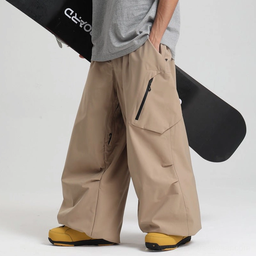 Khaki beige oversized snow pants low side angle male model gray tee yellow snow boots wide leg baggy fit