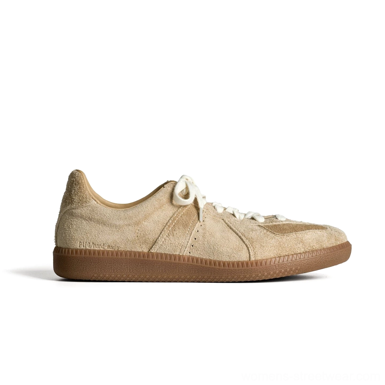 Neutral beige khaki suede heritage sneakers with classic low-top silhouette, subtle heel tab detail, and gum rubber sole