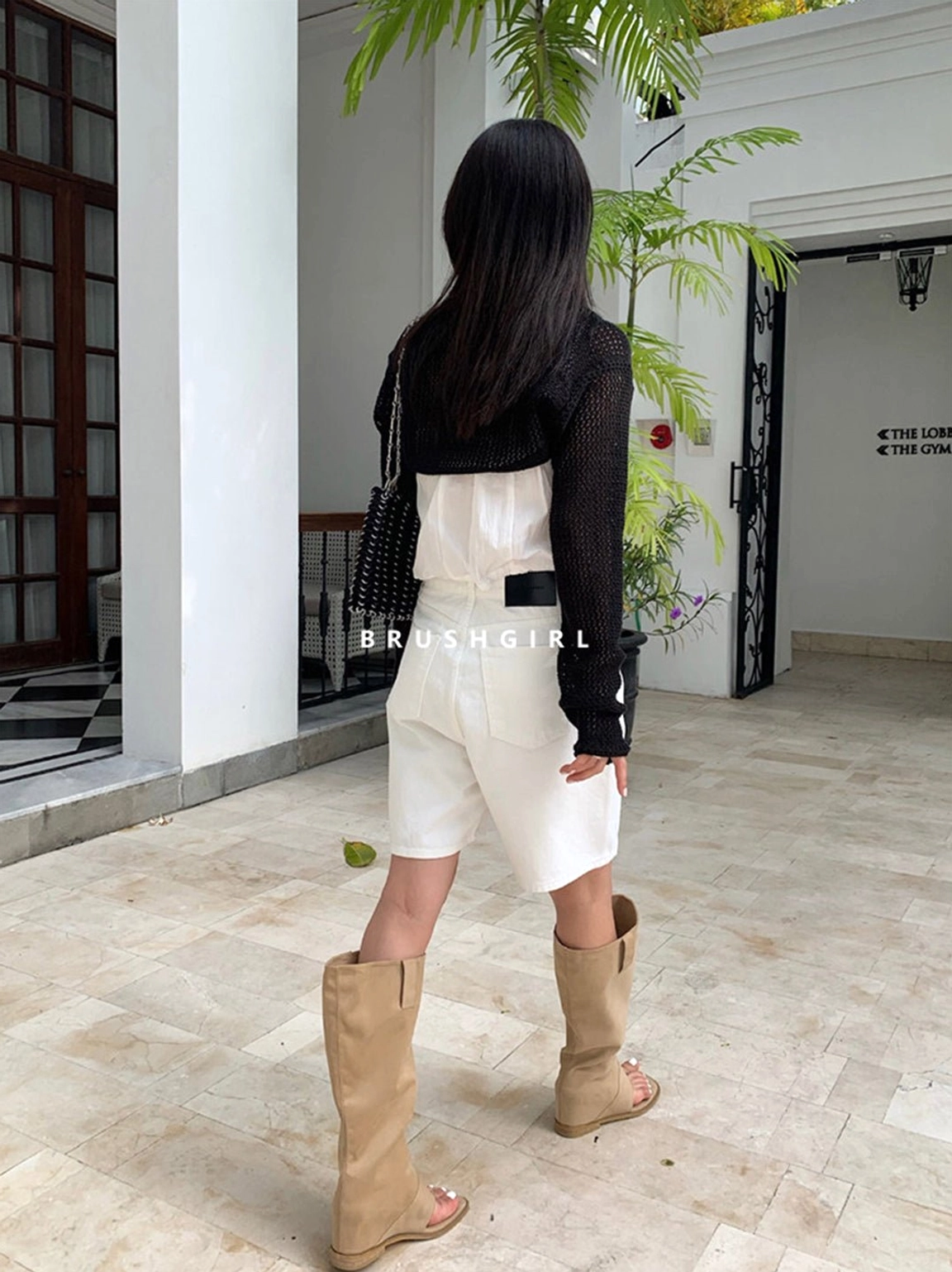 Khaki and black knee-high sandal boots with western-inspired shafts, adjustable buckle straps, and flat soles