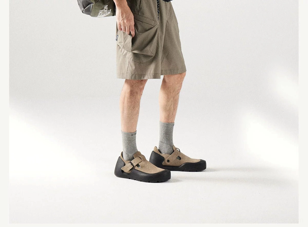 Side close-up of loose fit khaki cargo shorts with matte durable fabric and functional side cargo pocket