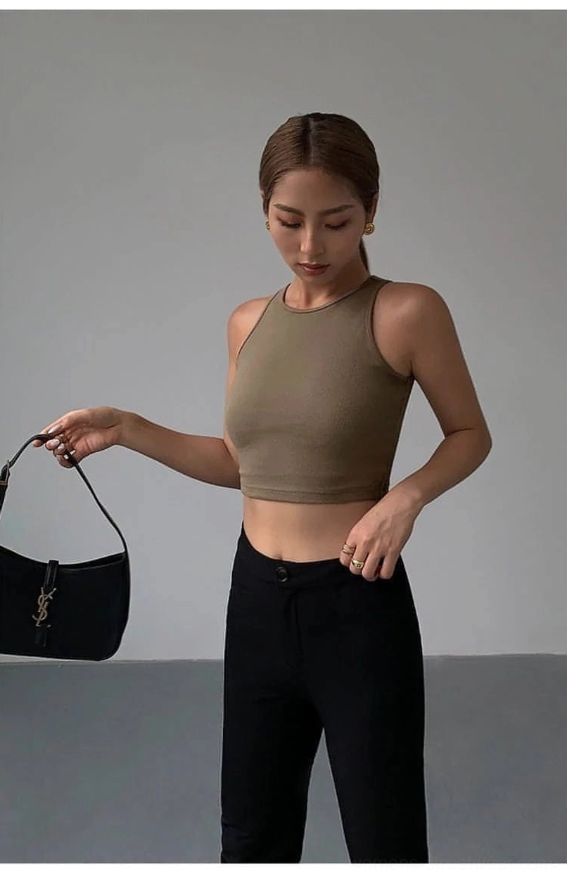 Khaki cropped tank top quiet elegance minimalist philosophy - showcasing how simple design elevates contemporary urban fashion and lifestyle aesthetic presence